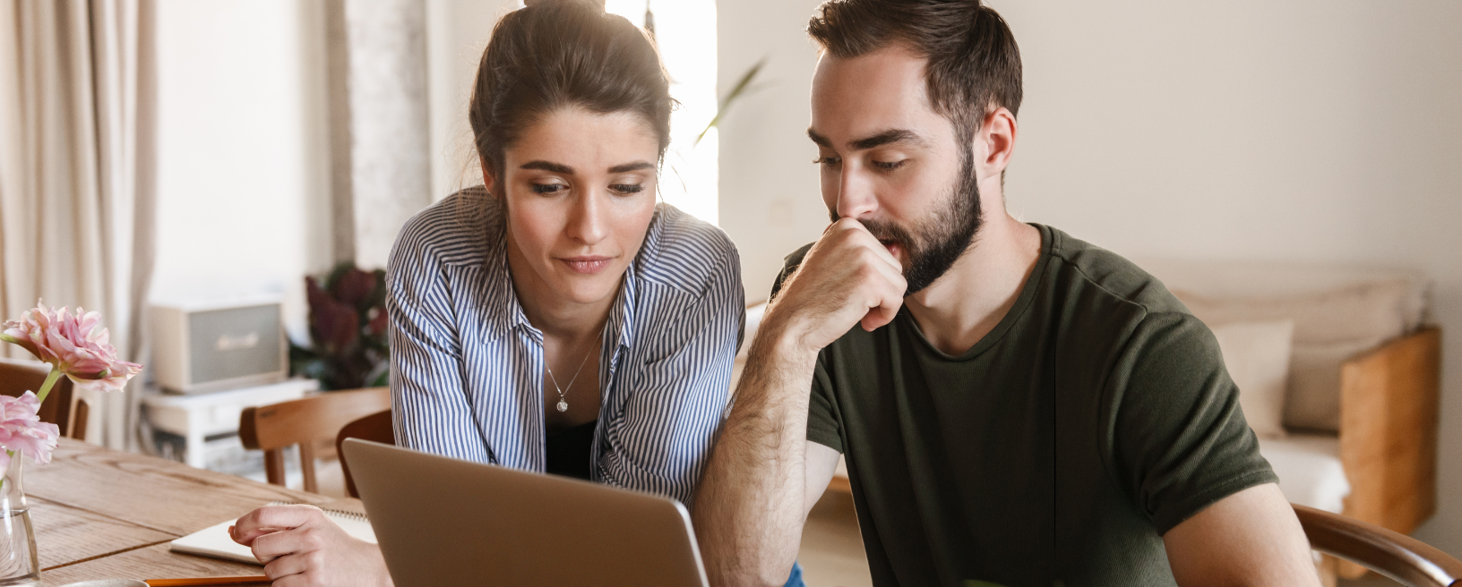 Couple reviewing documents together at home